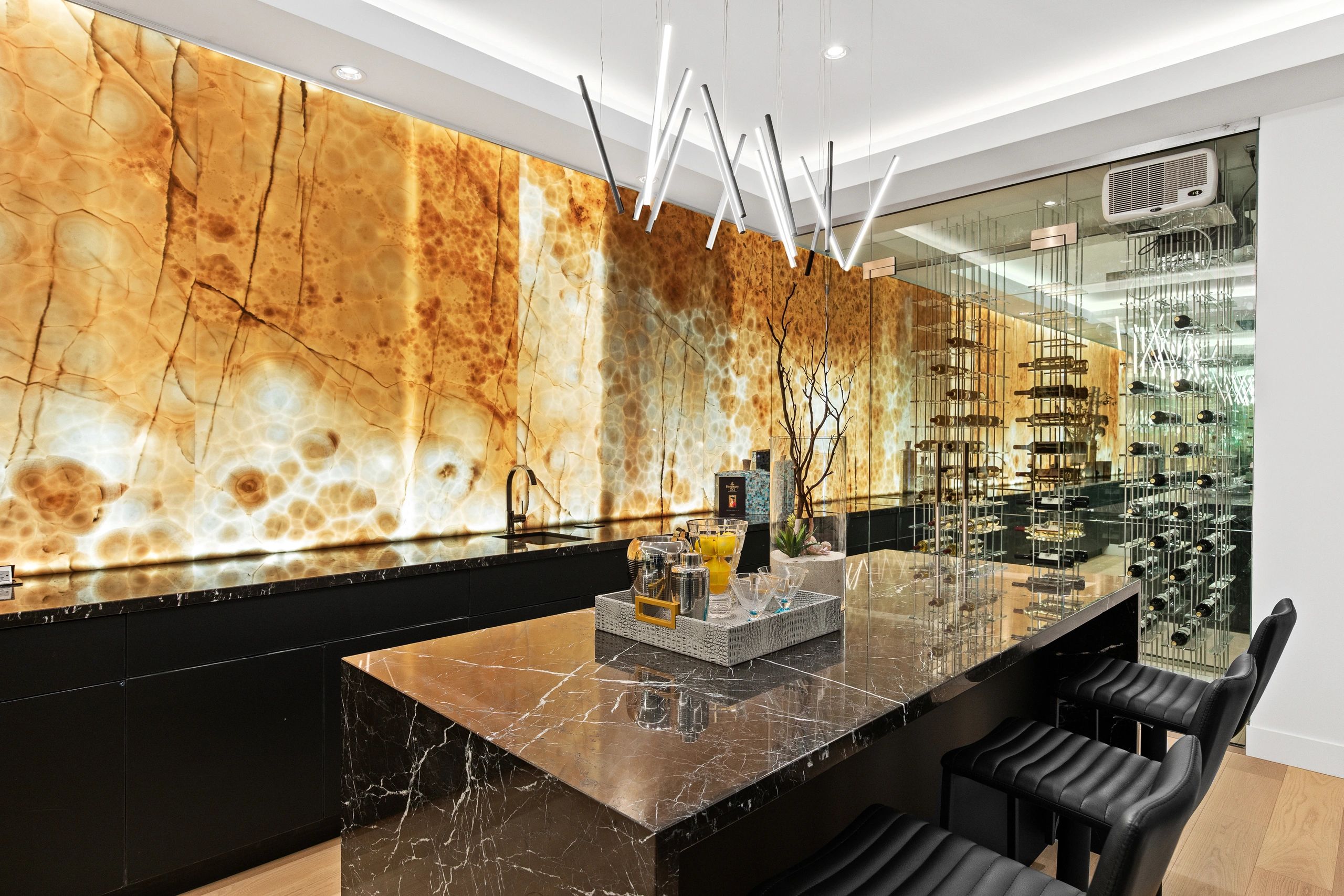 Backlit onyx bar wall and wine cellar